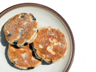 Welsh cakes are traditionaly made in Wales. They are a dough based cake baked on a gridle. 