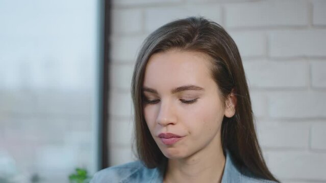 Portrait of a European woman. Young woman enjoys food