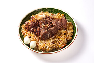 traditional Uzbek pilaf with meat and quail eggs on a white background