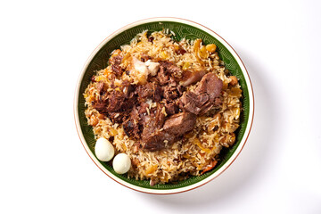 traditional Uzbek pilaf with meat and quail eggs on a white background