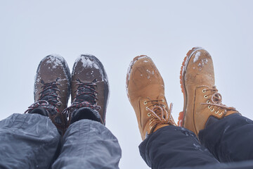 two pairs of men's winter shoes on a white background
