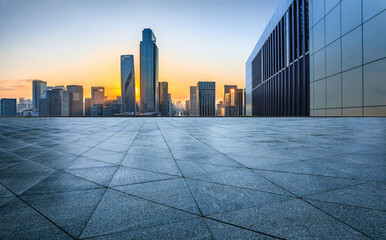 Fototapeta na wymiar Empty square floor and modern city skyline with buildings at sunset in Ningbo, Zhejiang Province, China.