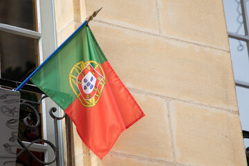 Flag of the Portugal in the wind facade Portuguese building