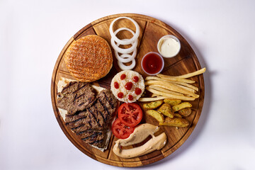 disassembled hamburger, on a wooden tray, on a white background