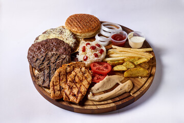 disassembled hamburger, on a wooden tray, on a white background