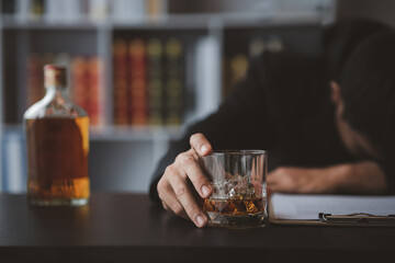 A lawyer holding a glass of whiskey, He's in his office, and he's stressing about arguing for a client, he's a lawyer. The concept of clear legal litigation.