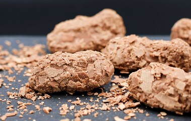 Chocolate truffles. Chocolate candy on a black background. Selective focus.