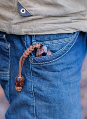 - Exclusive handmade knife in denim pocket of man