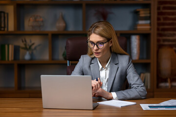 Fototapeta premium Shot of an attractive businesswoman working on laptop in her workstation.