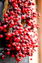 Red Christmas wreath decoration close up.