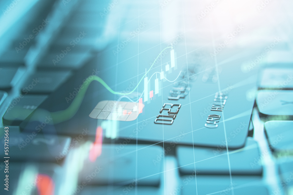Poster close up of notebook keyboard with bank card and forex hologram. trading, finance and online banking