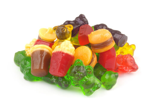 Heap of many gummy candies isolated on white background.