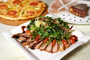 salad with meat and shrimp, tomatoes and herbs