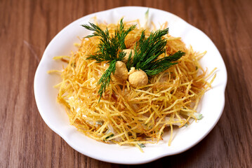 bird's nest salad on wooden background