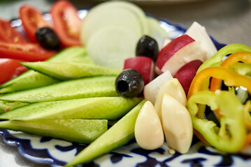 close-up salad, garlic, cucumbers, radishes, onions, tomatoes