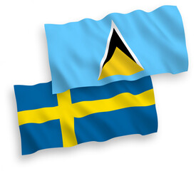 National vector fabric wave flags of Sweden and Saint Lucia isolated on white background. 1 to 2 proportion.