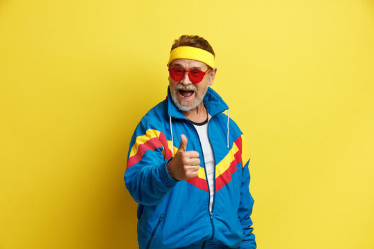 Man Showing Thumb Up. Bearded Grandfather Showing Finger Up, Like, Agree Hand Gesture Posing Isolated On Yellow Background Studio