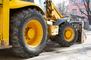 Fototapeta na wymiar excavator loader wheels, rear view