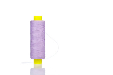 skein of thread purple colors macro on a white background