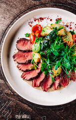Roastbeef salad with vegetables on plate