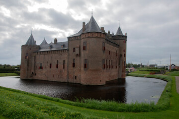 Fototapeta na wymiar Side View On The Back At At Muiderslot Castle At Muiden The Netherlands 31-8-2021