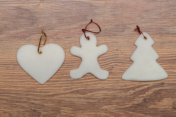 sugar Christmas tree ornaments on a wooden background