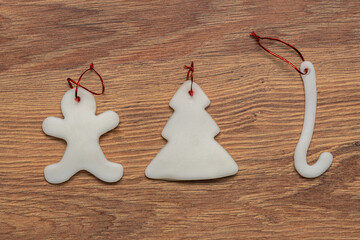 sugar Christmas tree ornaments on a wooden background
