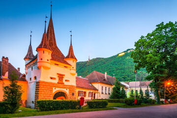 Fototapeta na wymiar Brasov, Romania. Catherine's Gate, medieval city walls, Transylvania travel landmark.
