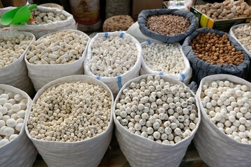 Big bags with kurut - dried cottage cheese in Osh Bazaar, central market in Bishkek, Kyrgyzstan.  