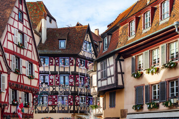 Christmas holidays on the streets of picturesque Colmar, Alsace. Bright colorful facades of...