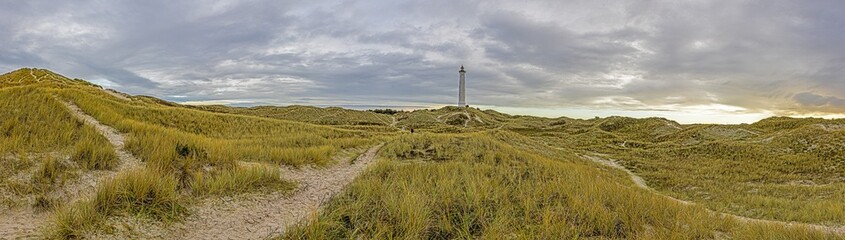 Fototapeta na wymiar Panoramic picture of Lyngvik beach lighthouse in Denmark daytime