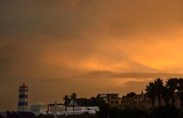 Fototapeta na wymiar Sunset over the Atlantic Ocean seen from the city of Cascais in Portugal
