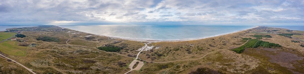 Drone panorama of lighthouse at Lyngvik beach in Denmark during the day