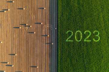 2023 Happy New year agriculture concept. Business, goals, success and new start banner. Corn field...