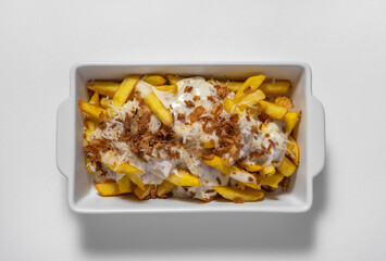 close-up of potatoes with meat sauce in a white bowl