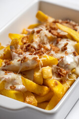 close-up of potatoes with meat sauce in a white bowl