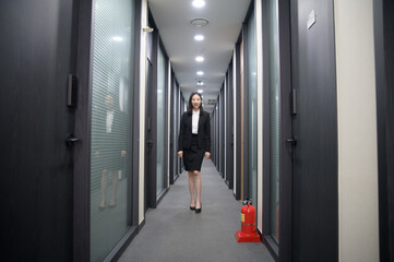 Fototapeta na wymiar Portrait of successful asian young businesswoman working in her office