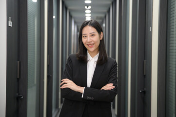 Fototapeta premium Portrait of successful asian young businesswoman working in her office