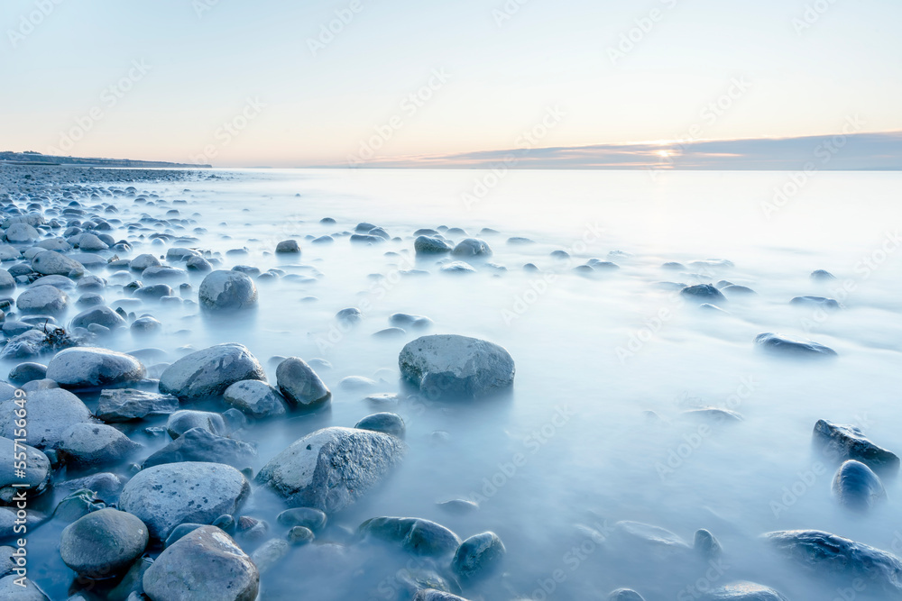 Sticker beautiful sun rise over the rocky coast in winter