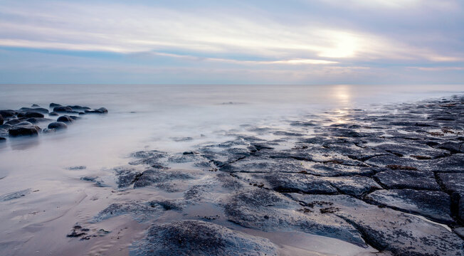 Beautiful Sun Rise Over The Rocky Coast In Winter