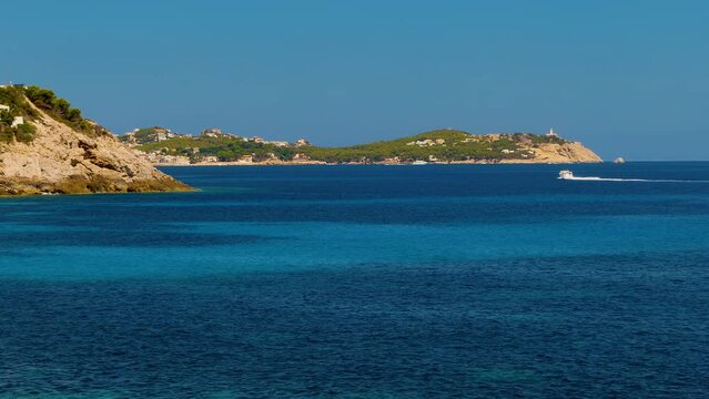 Panoramic view of COVE PROVEN&Ccedil;AL. Idyllic seascape of Mallorca Island in Balearic Islands (Spain) in the Mediterranean sea, with the smooth movement of the sea and boats at sunny day. 