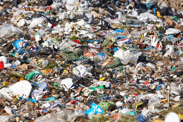 Open air garbage dump. Plastic waste pollution. Global warming. Consumerism