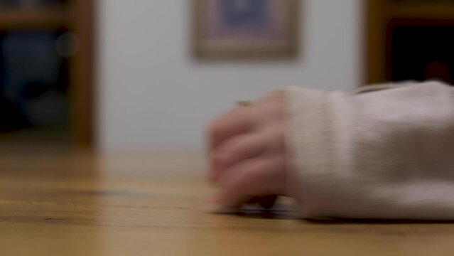 Jewish Dreidel spinning around. Hand spinning Hannuka dreidels - Sevivonim Jewish Dreidels spinning Close up. Jewish holiday traditions. Playing with toys Sevivon