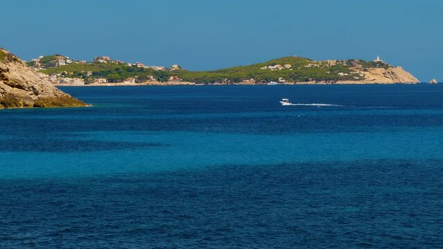 Panoramic view of COVE PROVEN&Ccedil;AL. Idyllic seascape of Mallorca Island in Balearic Islands (Spain) in the Mediterranean sea, with the smooth movement of the sea and boats at sunny day.Time lapse. 