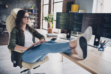 Photo of busy smart lady software specialist wear glasses programming modern gadget indoors workstation workshop