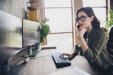 Photo of clever busy lady specialist wear glasses debugging tasks modern gadget indoors workstation...