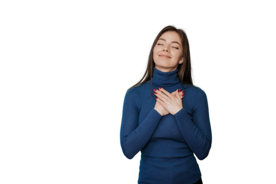 Eyes closed thankful Italian woman presses palms to heart expresses positive feelings, over transparent background feels touched to get help, makes gratitude gesture, in blue sweater, smiles sincerely - Powered by Adobe