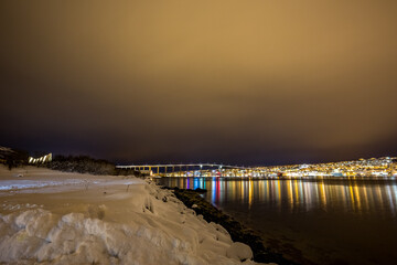 Long exposure night winter travel photograph taken near the city of Tromsø in Northern Norway.
