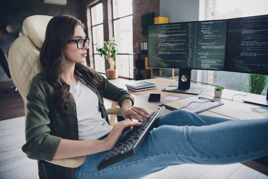 Photo of busy intelligent lady coder wear spectacles typing keyboard indoors workplace workshop