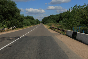 Beautiful rural road in the countryside, day landscape